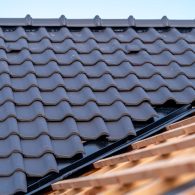 construction of the roof of a family house, wooden beams and ceramic bags.